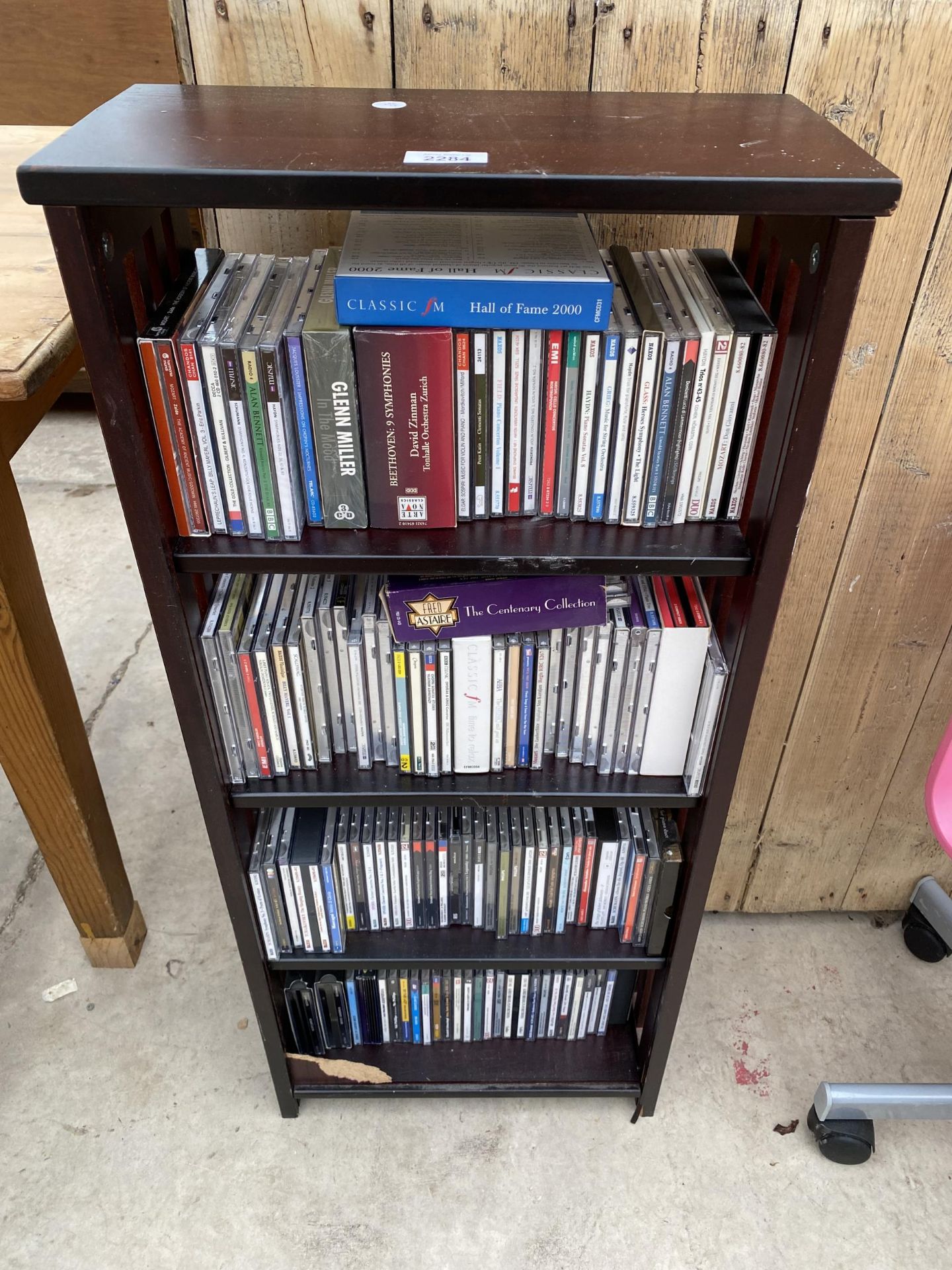 A CD STAND AND 100 PLUS VARIOUS CD'S