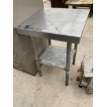 A SMALL SQUARE STAINLESS STEEL TABLE