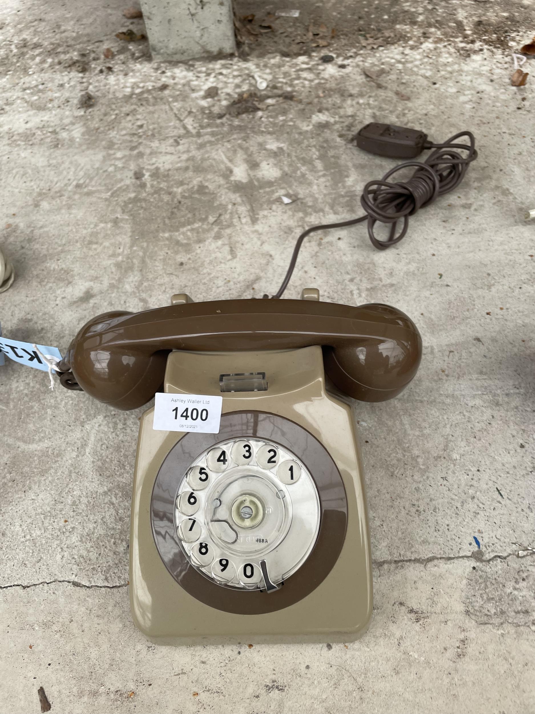 A RETRO BROWN ROTARY DIAL TELEPHONE