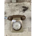 A RETRO BROWN ROTARY DIAL TELEPHONE