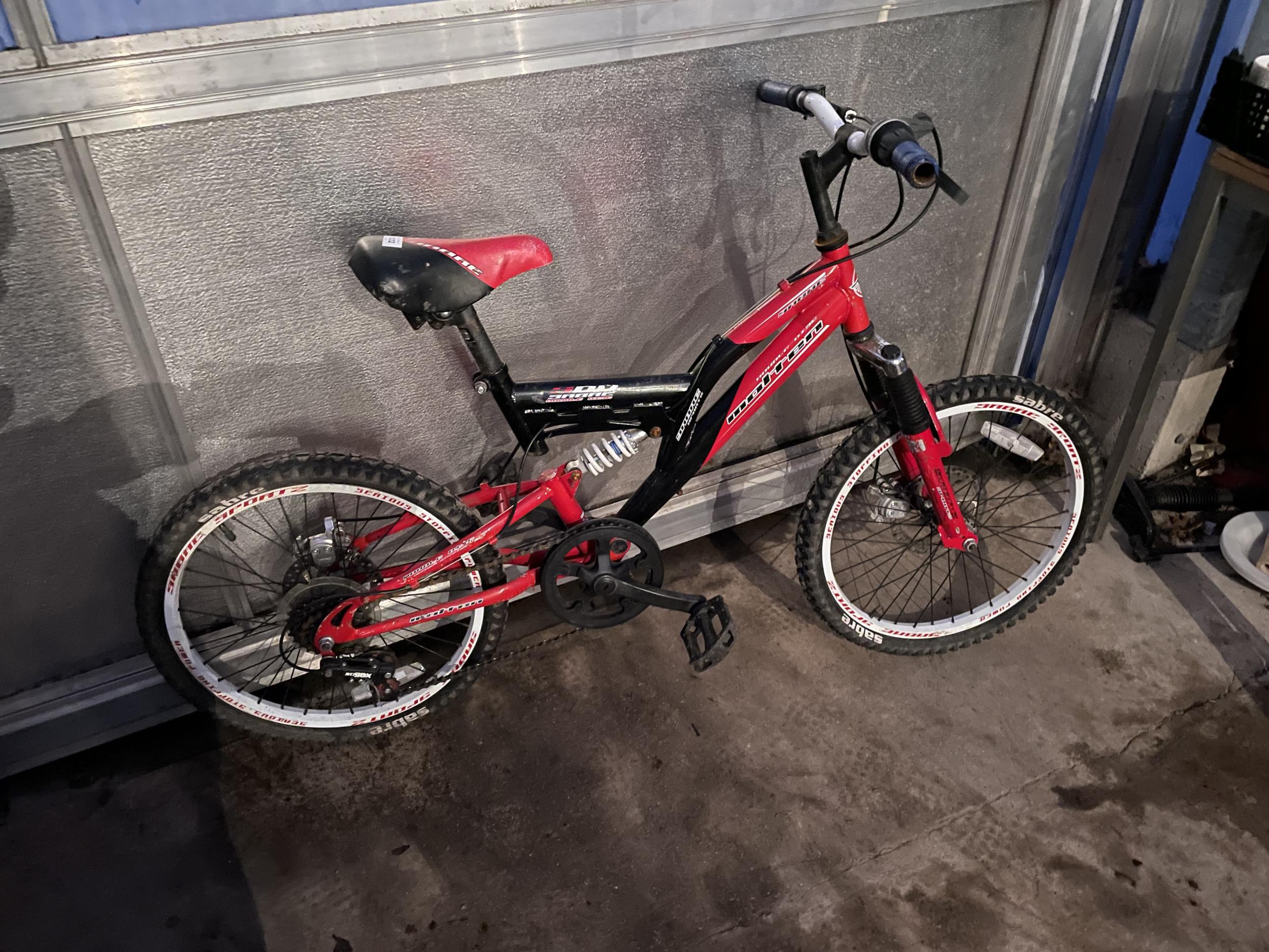 A CHILDRENS SABRE MOUNTAIN BIKE WITH FRONT AND BACK SUSPENSION AND 6 SPEED GEAR SYSTEM