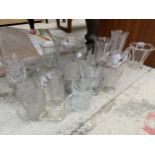 AN ASSORTMENT OF GLASS WARE TO INCLUDE VASES, TANKARDS AND BONBON DISHES ETC