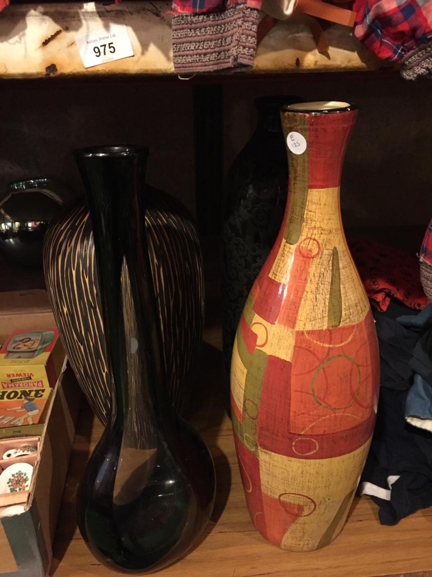 FOUR LARGE VASES TO INCLUDE A TERRACOTTA PATTERNED ONE, BLACK EMBOSSED, ETC