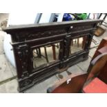 A SUBSTANTIAL VICTORIAN OVERMANTLE WITH TWO BEVEL EDGED MIRRORS AND CARVED DECORATION