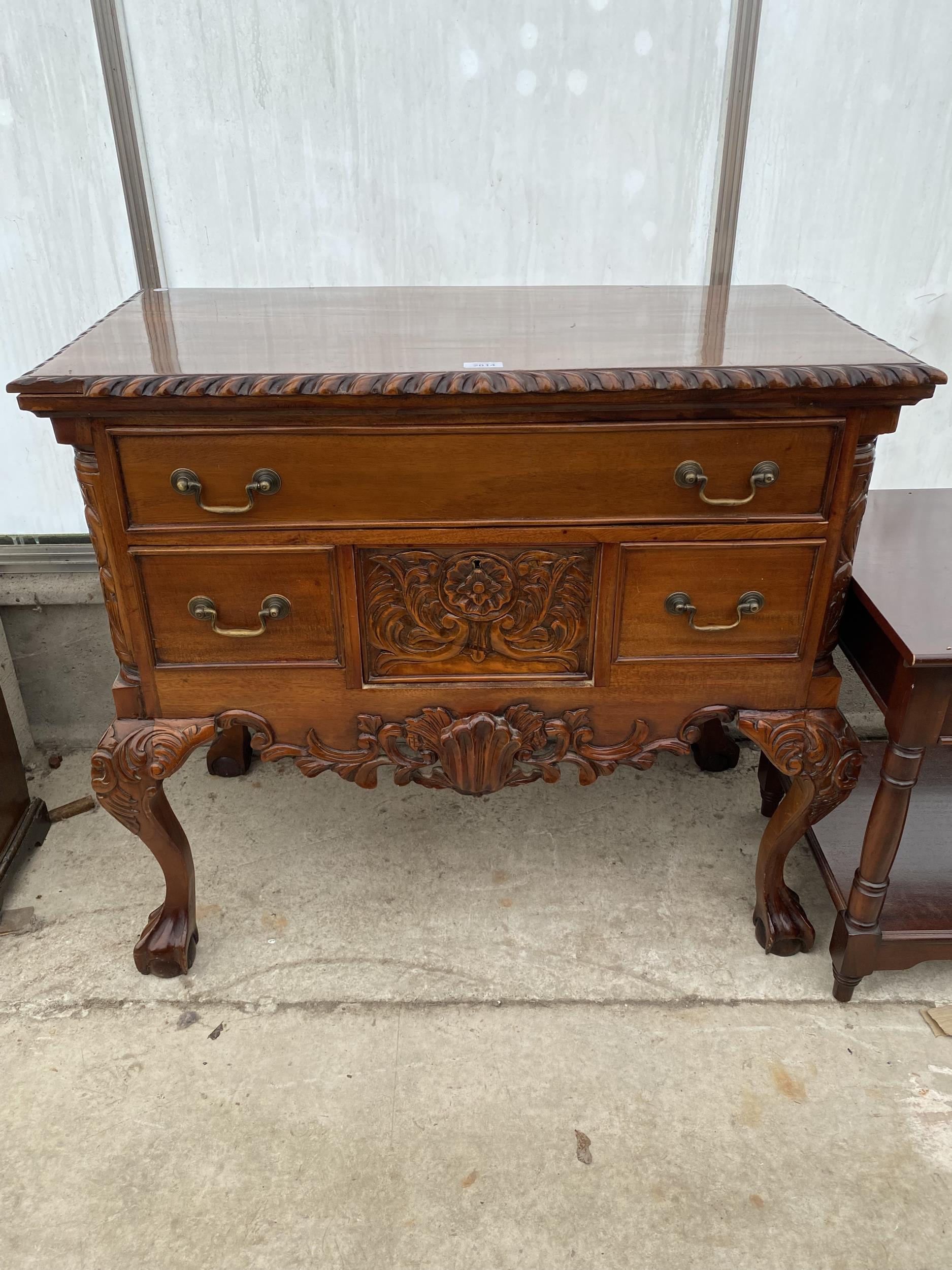 A CHIPPENDALE STYLE ROPE EDGE SIDE CHEST ON CABRIOLE LEGS WITH BALL AND CLAW FEET, 36" WIDE