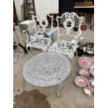 A CAST METAL PATIO FURNITURE SET TO INCLUDE TWO CHAIRS AND A ROUND COFFEE TABLE