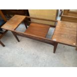 A RETRO TEAK COFFEE TABLE, LACKING THE GLASS INSERT