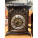 AN ORNATE VICTORIAN MANTLE CLOCK