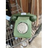 A RETRO GREEN ROTARY DIAL TELEPHONE