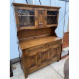 AN OAK WEBBER FURNITURE DRESSER WITH GLAZED AND LEADED UPPER PORTION, 48" WIDE