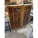 A SHINY WALNUT TWO DOOR CHINA CABINET ON CABRIOLE LEGS, 40" WIDE