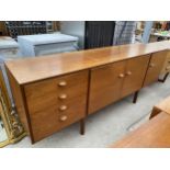 A RETRO TEAK SIDEBOARD, 78" WIDE, ENCLOSING FOUR DRAWERS AND THREE CUPBOARDS