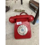 A RETRO RED ROTARY DIAL TELEPHONE