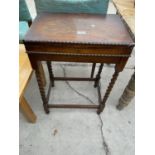 AN EARLY 20TH CENTURY OAK CUTLERY CANTEEN TABLE ON BARLEYTWISTS LEGS AND QUANTITY OF MIXED CUTLERY