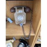 A RETRO BROWN ROTARY DIAL WALL MOUNTED TELEPHONE