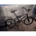 A BLACK BMX BIKE