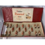 A BOXED BRITIANS ATTENDANTS TO THE STATE COACH EIGHTEEN PIECE MODEL SOLDIER SET - NUMBER 1475,