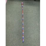 A RED, WHITE AND BLUE TWISTED GLASS WALKING STICK