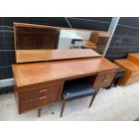 A RETRO TEAK AUSTINSUITE DRESSING TABLE AND STOOL, 66.5" WIDE