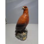 A CERAMIC BENEAGLES SCOTCH WHISKEY DECANTER IN THE DESIGN OF A GOLDEN EAGLE A/F