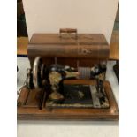 A VINTAGE CASED JONES SEWING MACHINE