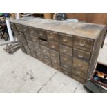 A LARGE VINTAGE FORTY DRAWER HABERDASHERY STORAGE UNIT