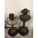 TWO LARGE HEAVY BASED OIL LAMPS (NO CHIMNEYS)