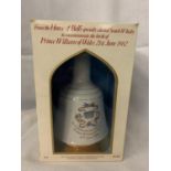 A BOXED BELL'S SCOTCH WHISKY IN A COMMEMORATIVE WADE PORCELAIN DECANTER TO COMMEMORATE THE BIRTH