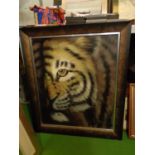A FRAMED PAINTING ON BOARD OF A TIGER