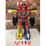 A VERY LARGE ARTICULATED POWER RANGERS ROBOT WITH LIGHTR UP EYES AND SHOOTS FROM ITS CHEST, INCLUDES