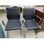 A PAIR OF EAMES STYLE CHROME FRAMED ELBOW CHAIRS