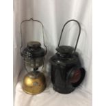 TWO VINTAGE OIL LAMPS TO INCLUDE THE ADLAKE NON SWEATING RAILWAY LANTERN AND A LARGE ORIGINAL TILLEY