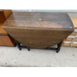 AN EARLY 20TH CENTURY OAK BARLEY TWIST GATELEG DINING TABLE