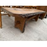 A RUSTIC COFFEE TABLE WITH BARK EDGES, 48 X 17"