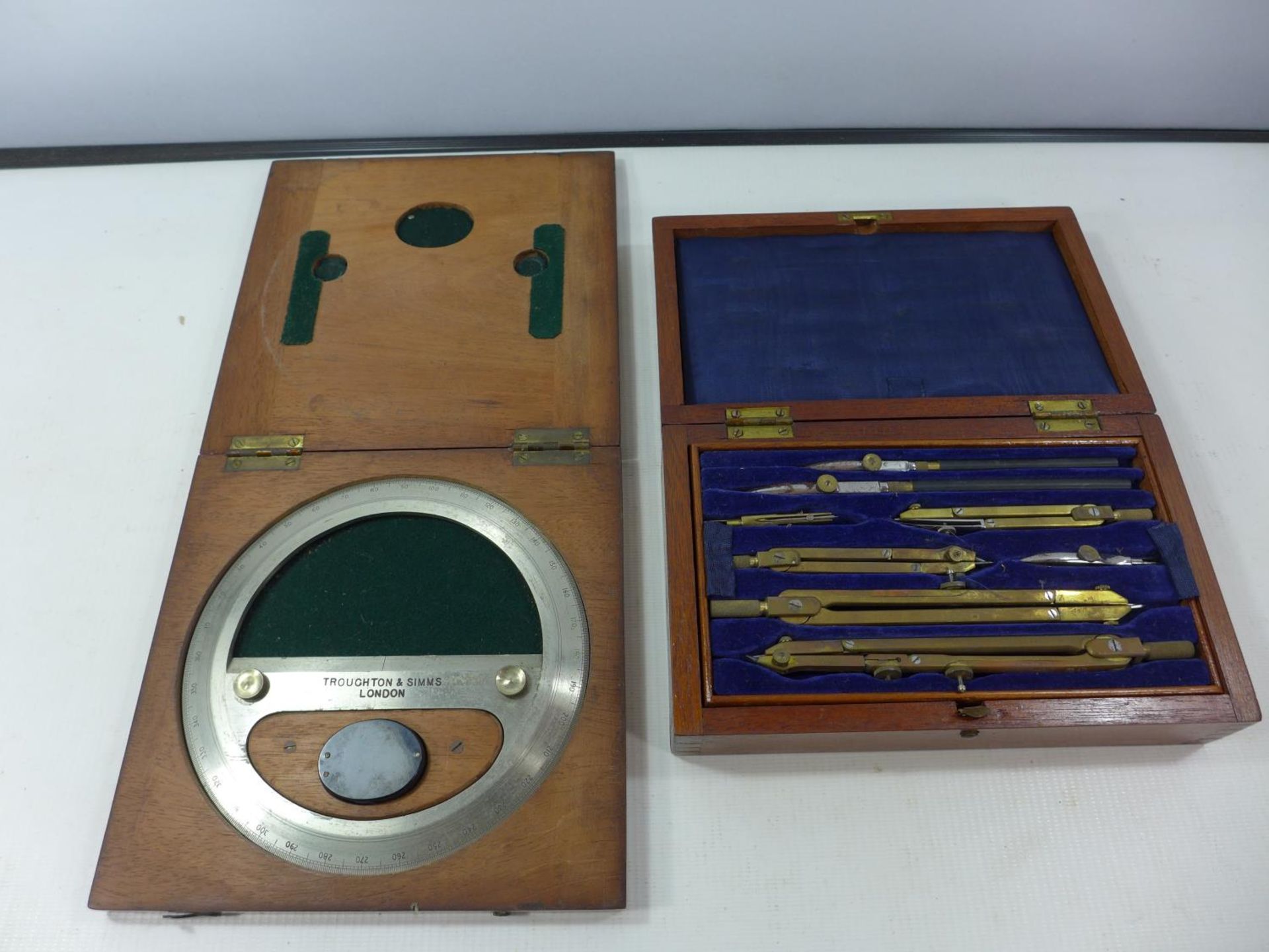 A CASED SET OF DRAWING INSTRUMENTS AND A CASED TROUGHTON AND SIMMS OF LONDON DEGREE RING AND