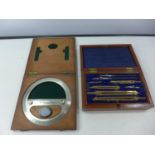 A CASED SET OF DRAWING INSTRUMENTS AND A CASED TROUGHTON AND SIMMS OF LONDON DEGREE RING AND
