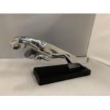 A LARGE CHROME JAGUAR MASCOT ON A BASE, LENGTH 37CM, HEIGHT 16CM