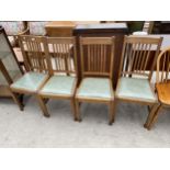 A SET OF FOUR EARLY 20TH CENTURY DINING CHAIRS