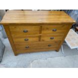 AN OAK CHEST OF FOUR SHORT AND ONE LONG DRAWER 46" WIDE WITH METAL SCOOP HANDLES