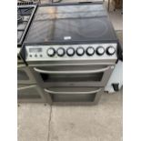 A SILVER ZANUSSI FREESTANDING ELECTRIC OVEN AND HOB