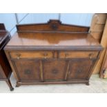 AN EARLY 20TH CENTURY OAK SIDEBOARD WITH RAISED BACK, 53" WIDE