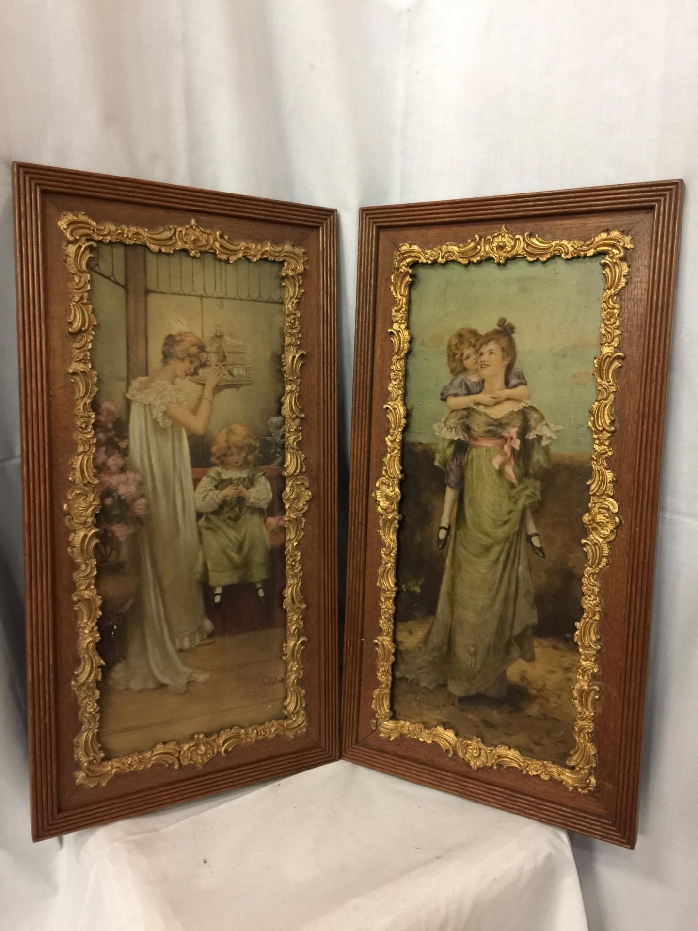 TWO HAND TINTED PRINTS OF VICTORIAN LADIES AND CHILDREN BY MAUDE GOODMAN - EACH IN AN OAK AND