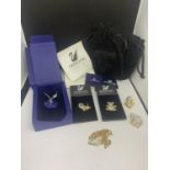 SIX ITEMS OF SWAROVSKI CRYSTAL TO INCLUDE TWO NECKLACES AND FOUR PIN BADGES SOME WITH BOX OR BAGS
