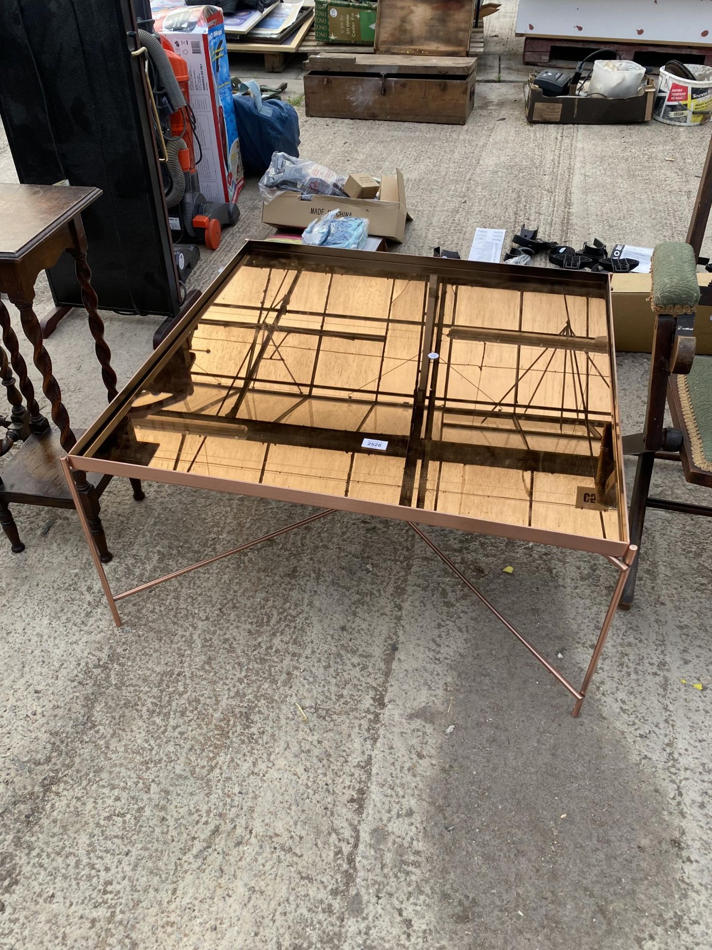 A MIRRORED GLASS COFFEE TABLE, 31.5" SQUARE