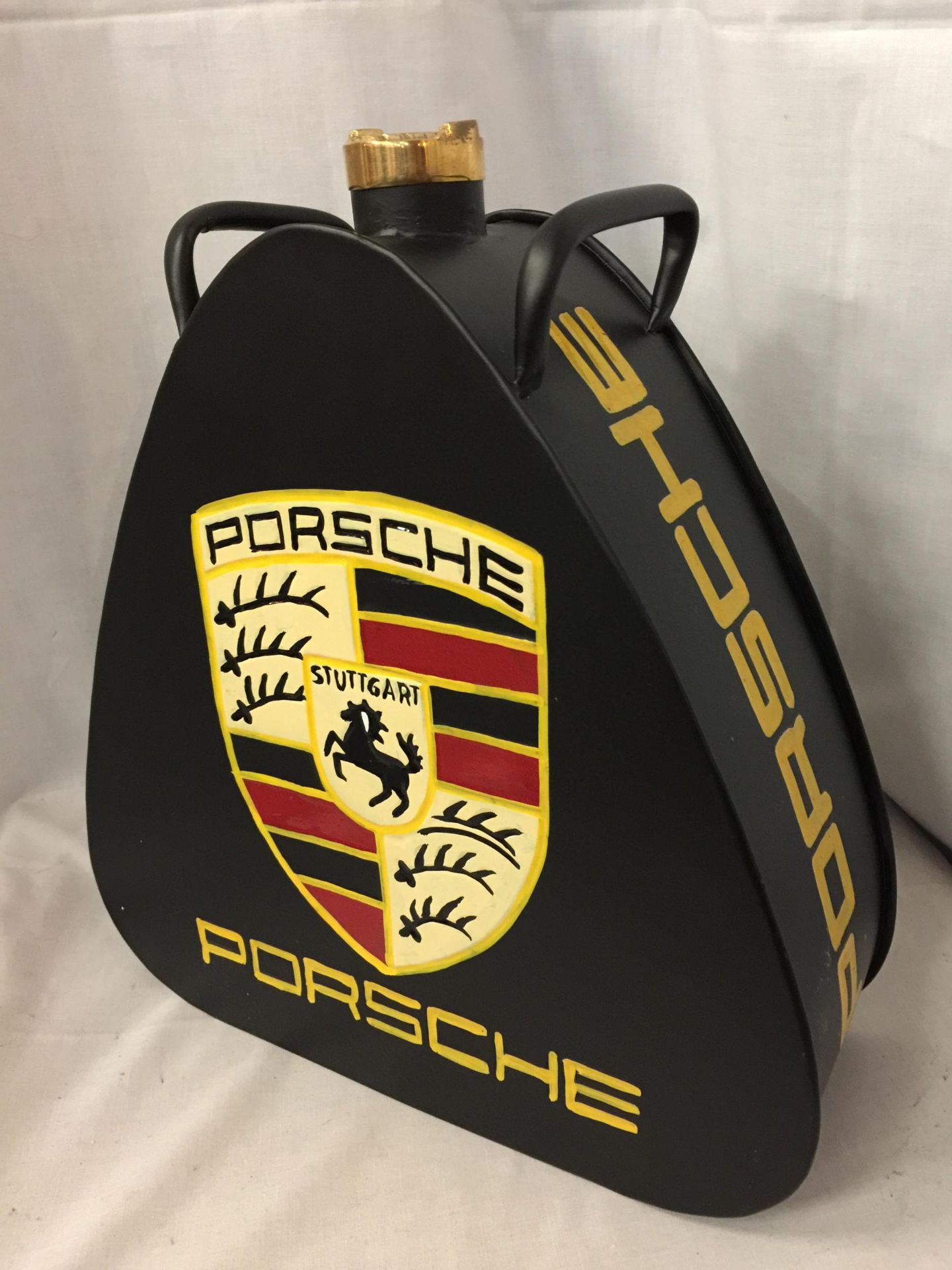 A BLACK PORSCHE PETROL CAN