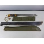 TWO MACHETES, 33CM AND 46CM BLADES COMPLETE WITH MATERIAL SCABBARDS (2)