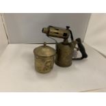 A BRASS BLOW LAMP AND A BRASS LIDDED POT