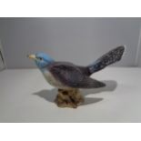 A BESWICK FIGURE MODEL 2315 THE CUCKOO