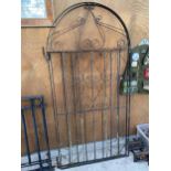A PAIR OF TALL WROUGHT IRON GARDEN GATES WITH CURVED TOPS (H:190CM W:93CM)
