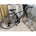 A BLACK GIANTS GENTS BIKE WITH 21 SPEED SHIMANO GEAR SYSTEM